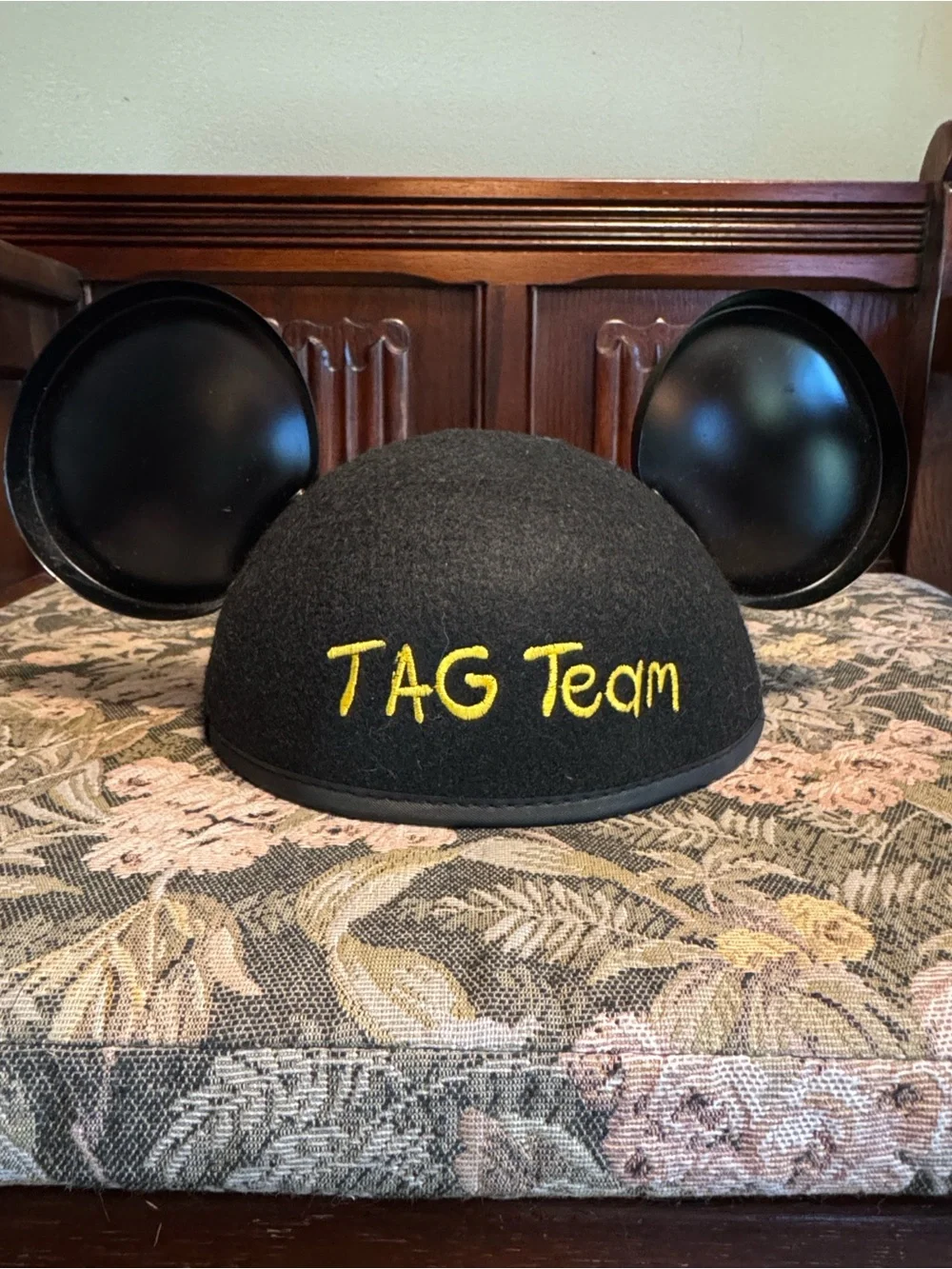 Disney black Mickey Mouse ears hat with red patch.